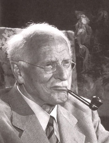 Photograph of Carl Gustav Jung in 1960. Black and white picture showing Jung with a pipe in his mouth