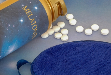 Melatonin in treatment for insomnia. The picture shows a bottle containig melatonine tablets
